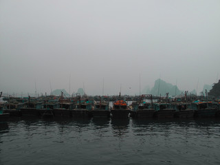 Fototapeta na wymiar Fishing boats in the sea row