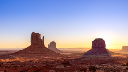 Beautiful sunrise view of famous Buttes of Monument Valley on the border between Arizona and Utah, USA