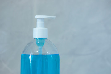 Liquid hygienic soap of blue color. Coronavirus prophylaxis, hand sanitizer. Hygiene concept.