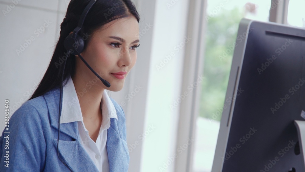 Aufkleber customer support agent or call center with headset works on desktop computer while supporting the cu