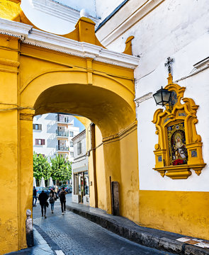 View of historic "Arco del Postigo del Aceite", an ancient entrance to the once fortified city of Seville.