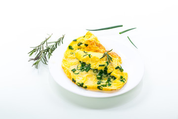 hot fried omelet with chopped green onions in a plate - obrazy, fototapety, plakaty