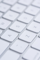 Computers. Keys of white minimalistic aluminium keyboard