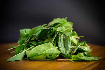 fresh cut sorrel leaves on a wooden table