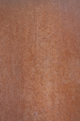 The surface is painted rust. Rusted metal wall. Grunge rusty metal background