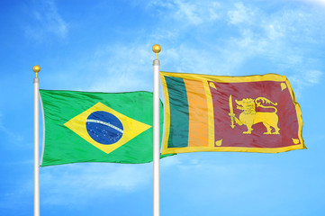 Brazil and Sri Lanka two flags on flagpoles and blue cloudy sky