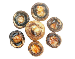 Baked mushroom stuffed with butter and cheese isolated on a white background