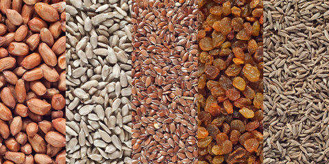 Textures of spices and seasonings. Sunflower seeds, peanuts, cumin, flax and raisins on the heap.