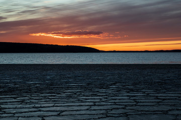 Fototapeta na wymiar Sunset over an icy lake