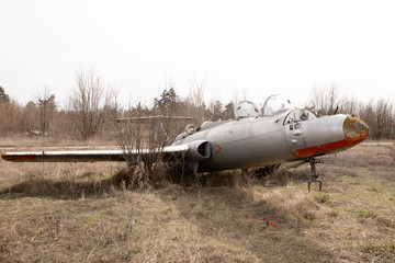 Old abandoned plane outside in autumn
