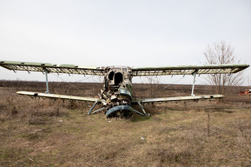 Old abandoned plane outside in autumn
