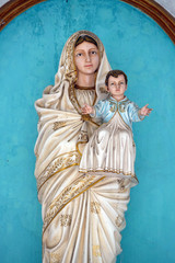 Virgin Mary with baby Jesus, statue on the portal of Our Lady of Lourdes Church in Kumrokhali, West Bengal, India