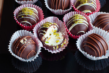 Hand in gloves shows what is inside chocolate candies