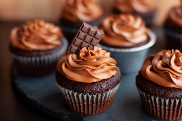 Chocolate cupcakes with chocolate cream on top