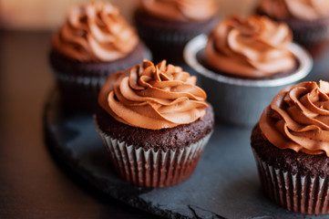 Chocolate cupcakes with chocolate cream on top