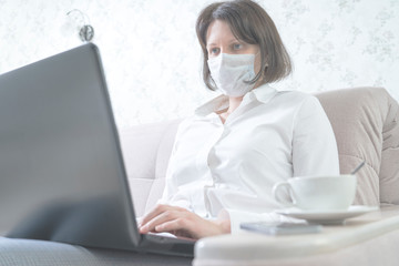 the girl working remotely during an outbreak of the coronavirus, selective focus, toned image.