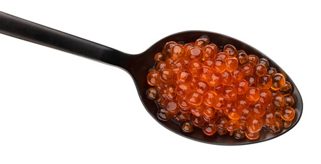Red caviar in black spoon isolated on white background