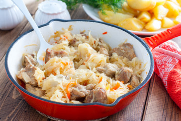 Braised sauerkraut in a pan, selective focus