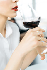 Young woman with glass of wine