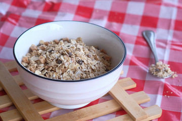 top view of oat flakes in bowl, healthy eating concept 
