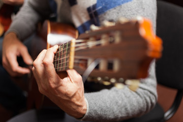 Detail of a classical guitar player