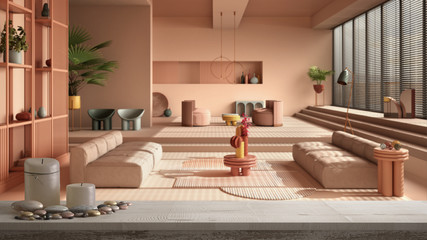 Wooden vintage table top or shelf with candles and pebbles, zen mood, over colored contemporary living room, pastel rosy colors, sofa, white architecture interior design