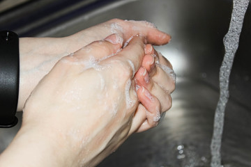 Fototapeta premium Protect against viruses and infections by washing your hands with soap.