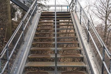 Old Industrial Symmetrical Steel Staircase in Hamilton, Ontario climbing up to the mountain