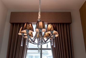 A warm color lamp hanging on the ceiling
