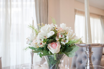 Roses in vases on the  dining table