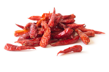 Dried pepper chillies on white background