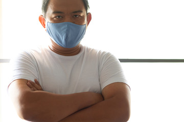 Asian Man wearing hygienic mask to prevent infection, airborne respiratory illness such as flu, Protection against contagious disease, coronavirus
