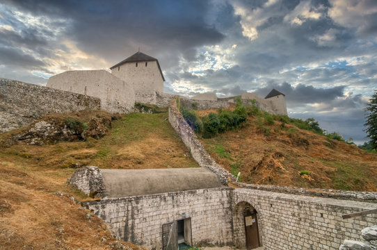 Tesanj castle from the Ottoman period with fortified gate, cannot tower with dramatic sky in Bosnia Herzegovina