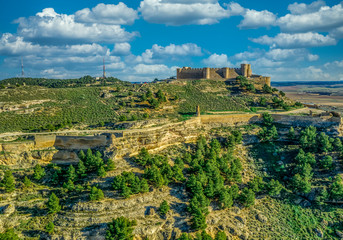 Aerial panoramic view of Chichilla de Montearagon, medieval hilltop fortification near Albacete surrounded by a deep dry moat