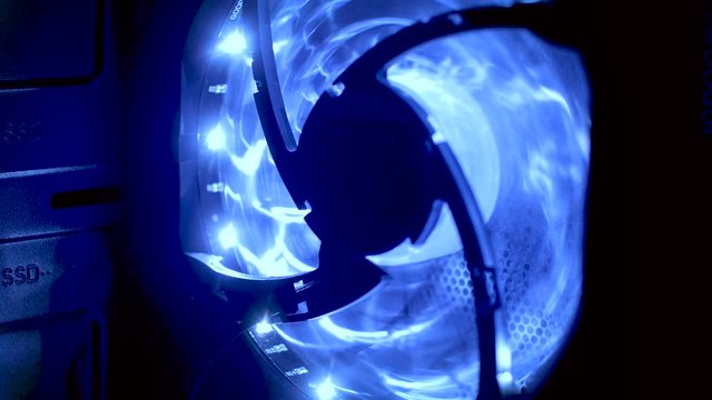 Electric fan with blue light close-up.