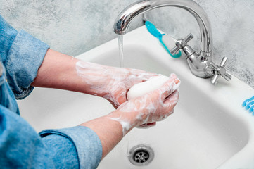 Woman Very Carefully Washing Hand with Soap During Epidemic Coronavirus