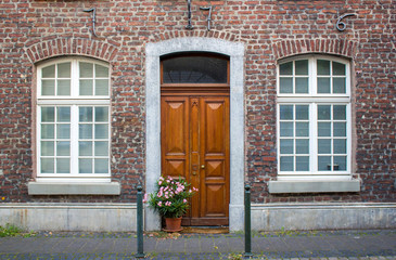 Old German house with wooden door and windows