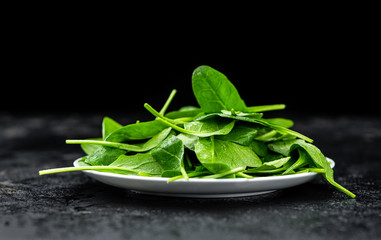 Spinach on a vintage background (close-up; selective focus)