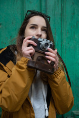 Photo of young tourist girl exploring streets of Baku. Moody photos of teenager girl visiting old city and taking photos of the city