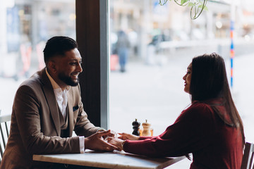 Young loving couple in cafe together. Love, family concept