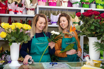 Two Young Woman Working with Flower in flower shop