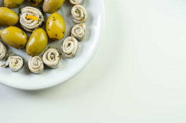 Marinated anchovies with lemon vinegar olive oil parsley and green olives