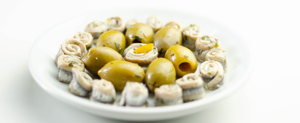Marinated anchovies with lemon vinegar olive oil parsley and green olives