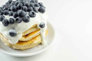 Delicious pancakes with sweet creamy yogurt and fresh berries