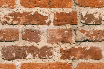 Orange brick wall texture background. Pattern of weathered old cracked brickwall. Stacked stones wall rough surface. Obsolete grunge surface. Vintage wallpaper. Material design