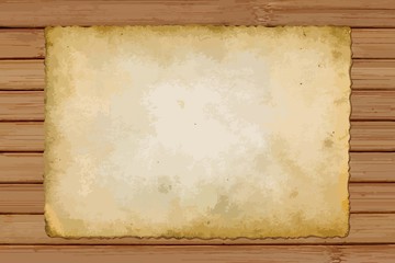 old card of paper on wooden background