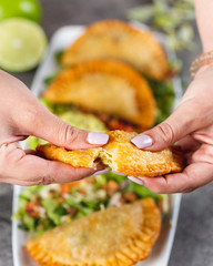 Breaking open an empanada