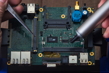 Fototapeta premium Fix and repair of electronic computer board