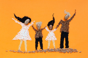 Beans and seeds art. Crop art. Child drawing of happy family. Symbol of healthy vegetarian diet