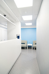 Clean white empty corridor of a dental clinic